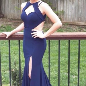 Navy blue prom dress with open back.